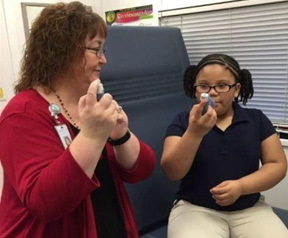 2019-girl-getting-asthma-treatment-in-mobile-unit